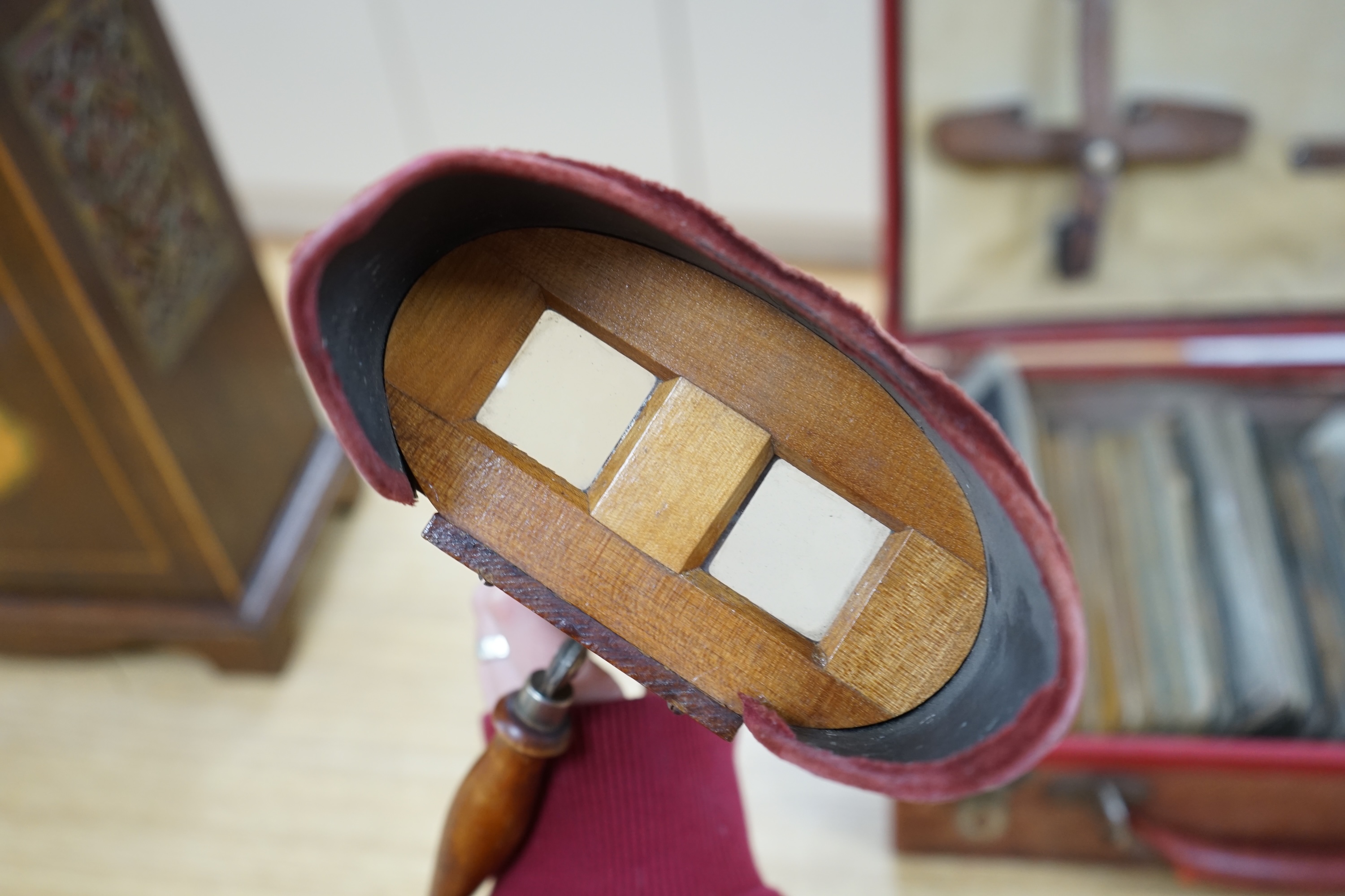 An R.K. White Co. stereoscopic viewer and a collection of slides, viewer 33cm long. Condition - cards have been damp at some point